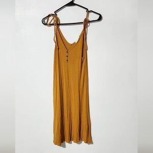 Every sleeveless open v neck mustard mini dress